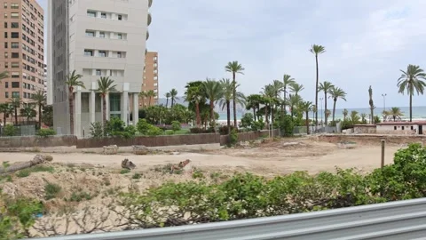 Fenced area on the beachfront for the construction of new apartments in Benidorm Stock Footage 333900104