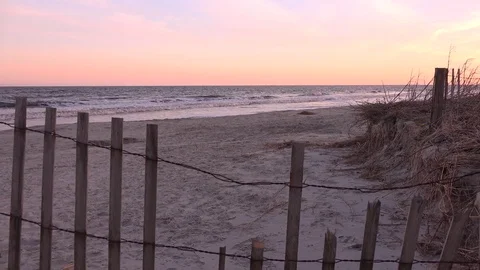 Fenced beach at twilight Stock Footage 71744084