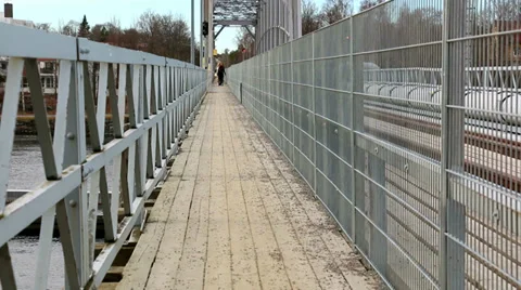 Fenced footpath on a railroad bridge Stock Footage 36950080