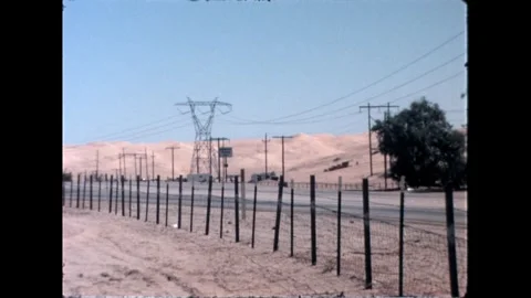 Fenced road in desert Stock Footage 276290435