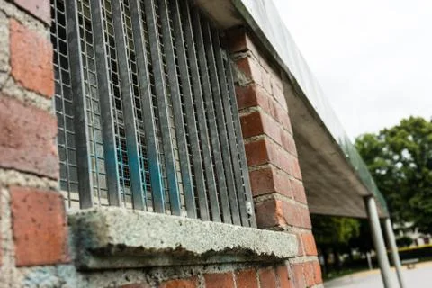 Fenced off window on brick wall Stock Photos