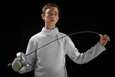 Fencer boy isolated on black Stock Photos
