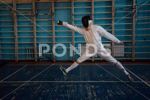 The fencer prepares for competitions. fencing coach. fencing sport motivation Stock Photos
