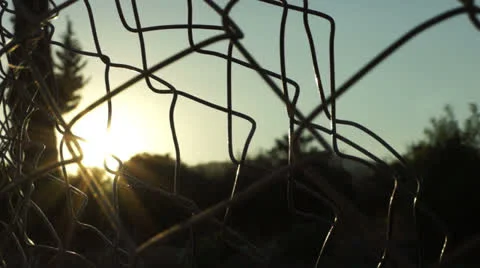 Fences in front of the sun (1) Stock Footage 26572067