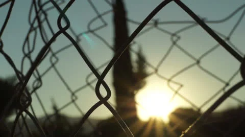 Fences in front of the sun (2) Stock Footage 26581699