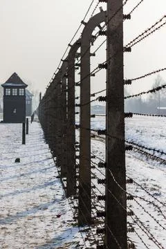 Fences strung with electrified barbed wire Stock Photos