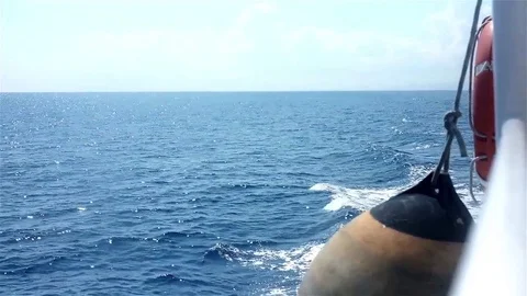 Fender and life buoy on the side of the moving boat Stock Footage 83503529