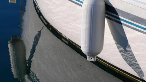 The fender hanging from the side of the boat. Stock Footage 268901399
