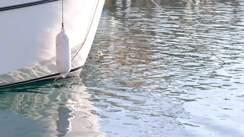 The fender hanging from the side of the boat. Stock Footage 268903551