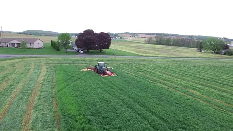 Fendt tractor mowing in field Stock Footage 75123476
