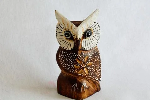 Feng Shui multi-colored owl figurine made of wood Stock Photos