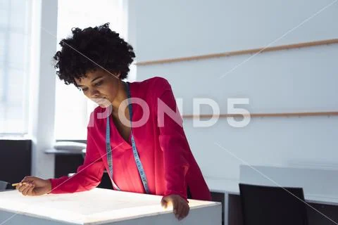 Fenmale student working on a project at a fashion college Stock Photos