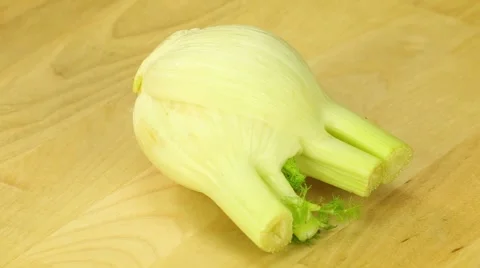 Fennel is rotated against the background of wooden boards Stock Footage 42952353