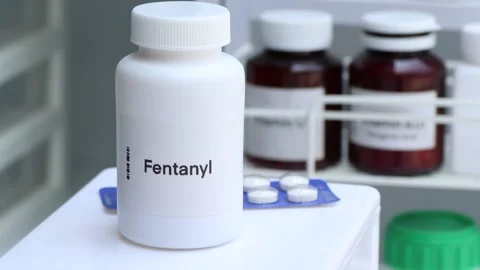 Fentanyl pill in white bottle Stock Footage 236901144