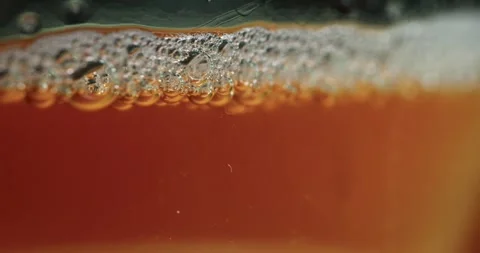 Fermentation Process of Kombucha Showcased With Bubbles and Rich Colors in a Stock Footage 314729733