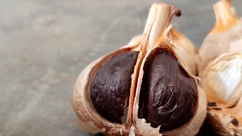 Fermented black garlic Stock Footage 341316800