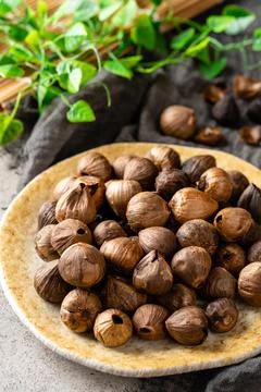 Fermented black garlic. Stock Photos