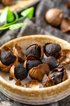 Fermented black garlic. Stock Photos