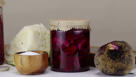 Fermented cabbage with beets in glass jars Stock Footage 121809195