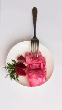 Fermented cabbage, with beets on a plate Stock Photos