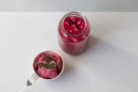 Fermented cabbage, with beets on a plate Stock Photos