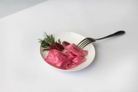 Fermented cabbage, with beets on a plate Stock Photos