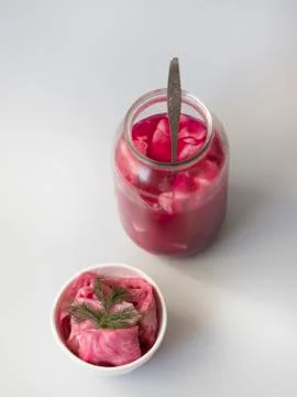 Fermented cabbage, with beets on a plate Stock Photos