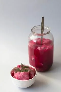Fermented cabbage, with beets on a plate Stock Photos