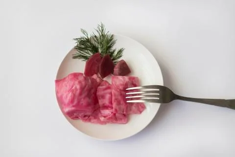 Fermented cabbage, with beets on a plate Stock Photos