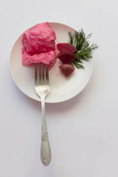 Fermented cabbage, with beets on a plate Stock Photos