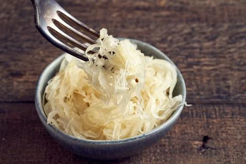 Fermented cabbage on a fork Stock Photos