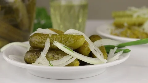Fermented cucumbers sprinkled with chopped white onions Stock Footage 121905119