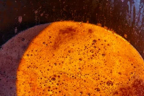 Fermenting grape must bubbling during winemaking process in winery Stock Photos