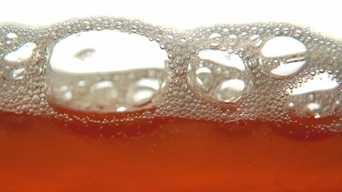 Fermenting Tepache Bubbles Macro Texture. Abstract Orange Liquid. Stock Footage 323325241