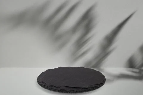 Fern leaf shadow and a black stone slab on gray background, abstract backdr.. 스톡 사진