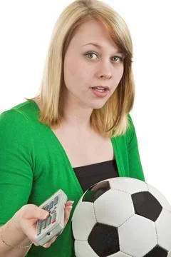  Fernsehprogramm Junge Frau mit Fussball und Fernbedienung- freigestellt a... Stock Photos