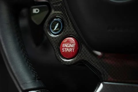 Ferrari 458 Speciale engine start button on steering wheel, carbon fiber details Photos