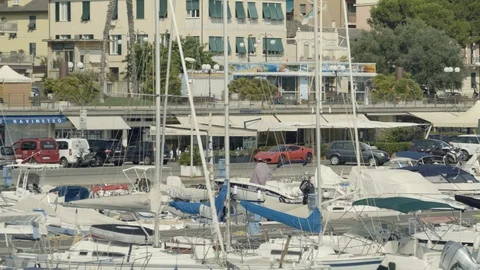 Ferrari driving through Harbor  Stock Footage 95999329