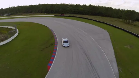 Ferrari on racetrack, aerial view Stock Footage