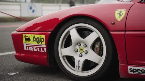 Ferrari on a racetrack paddock Stock Footage 279971720