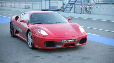 Ferrari in red comes to the pitstop Stock Footage 20709606