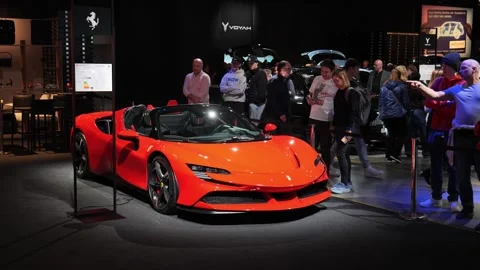 Ferrari stand showcasing the SF90 Aperta hybrid supercar at the Auto Zurich Stock Footage 320387340