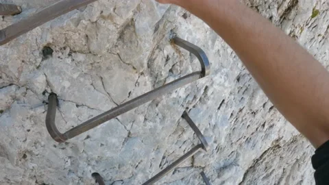 Via Ferrata vertical ascent climbing steps in the alps mountains close-up POV Vidéo 161525179