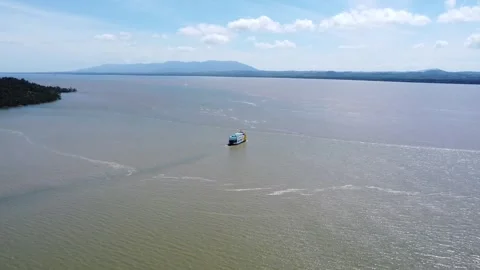 Ferries carrying passengers pass through the Kalimantan Sea Stock Footage 265738128