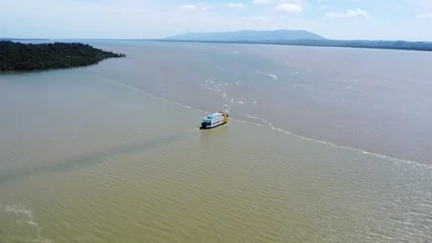 Ferries carrying passengers pass through the Kalimantan Sea Stock Footage 265738296