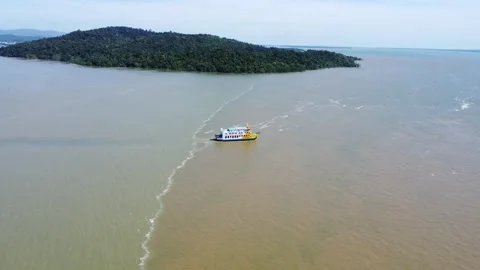 Ferries carrying passengers pass through the Kalimantan Sea Stock Footage 265738643