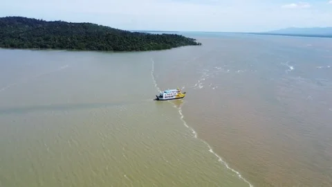 Ferries carrying passengers pass through the Kalimantan Sea Stock Footage 265738772