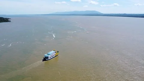 Ferries carrying passengers pass through the Kalimantan Sea Stock Footage 265739544