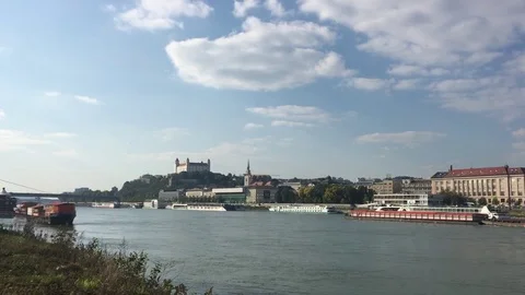 Ferries on the Danube river with a view over Bratislava old city and castle Stockbeeldmateriaal 81355130