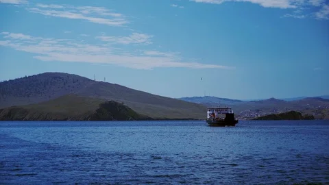 Ferries run between the mainland and the island Olkhon in Baikal. Ferry crossing Stock Footage 125465865